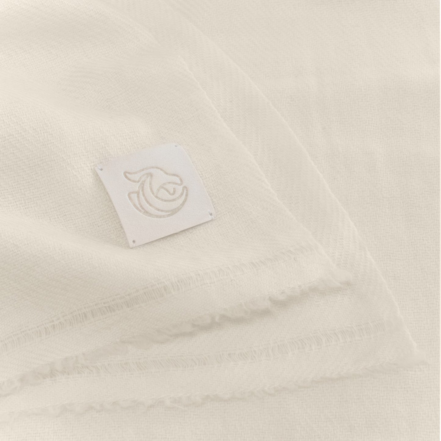 A woven cashmere shawl natural white